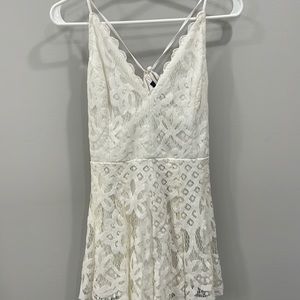 White lace romper with sweetheart neckline